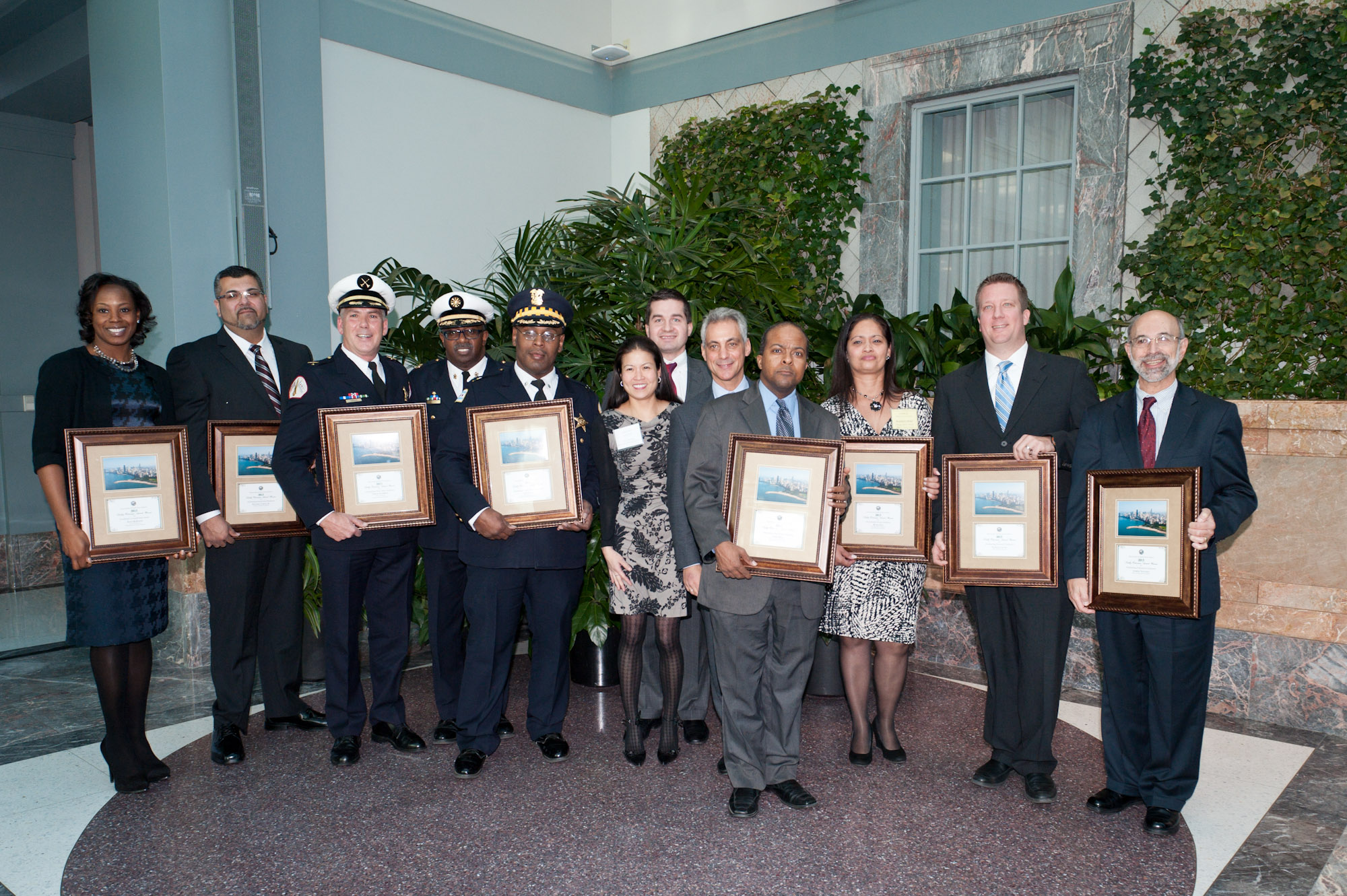 Mayor Rahm Emanuel, Department of Human Resources Commissioner Soo Choi, and John Kedzierski, Director, Motorola Solutions with the 2013 Kathy Osterman Award Recipients.